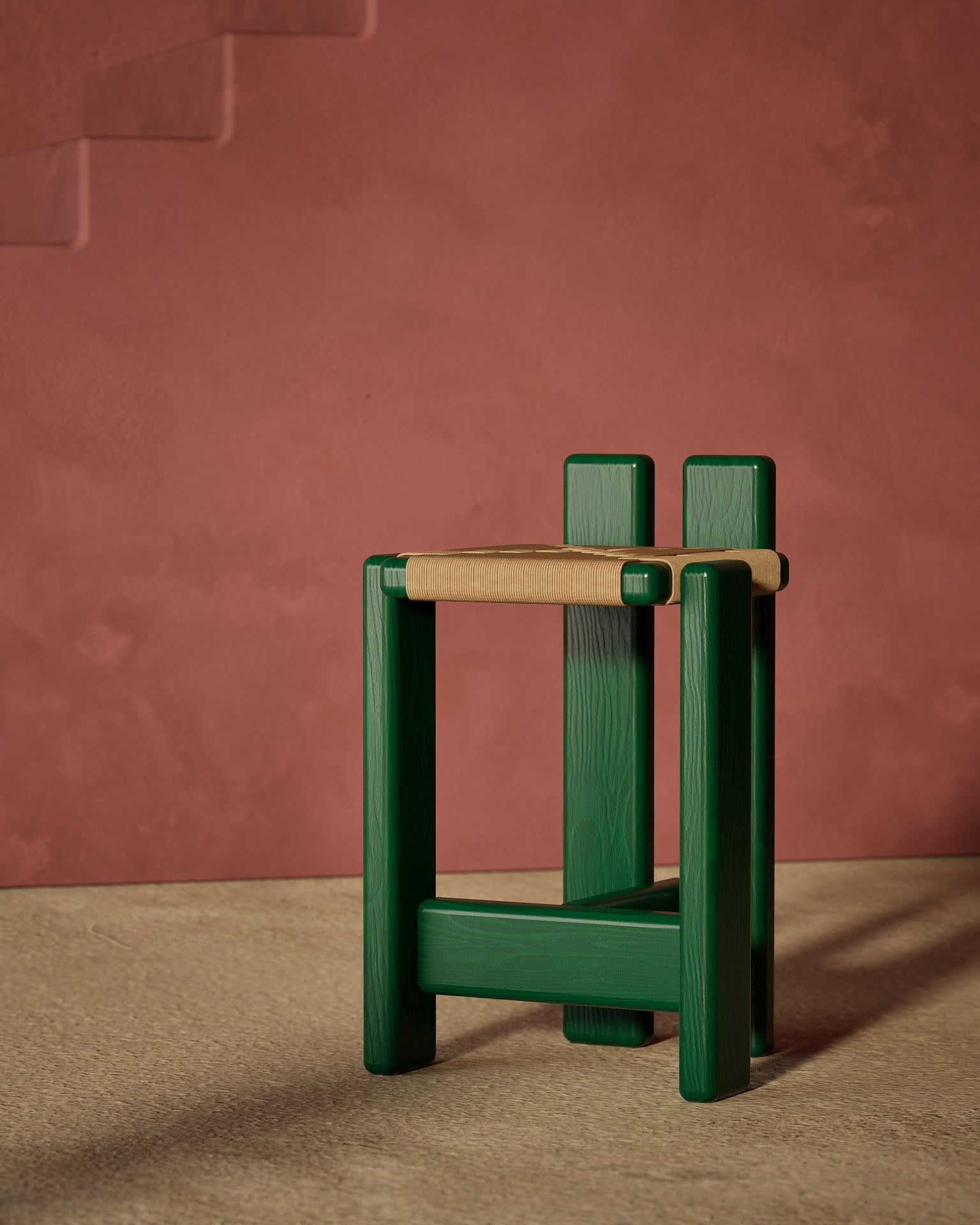 Green lacquered Bold Barstool with handwoven seat against a pinkish-brown wall